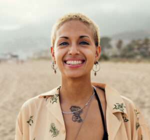 buccal fat deposit model on beach grinning